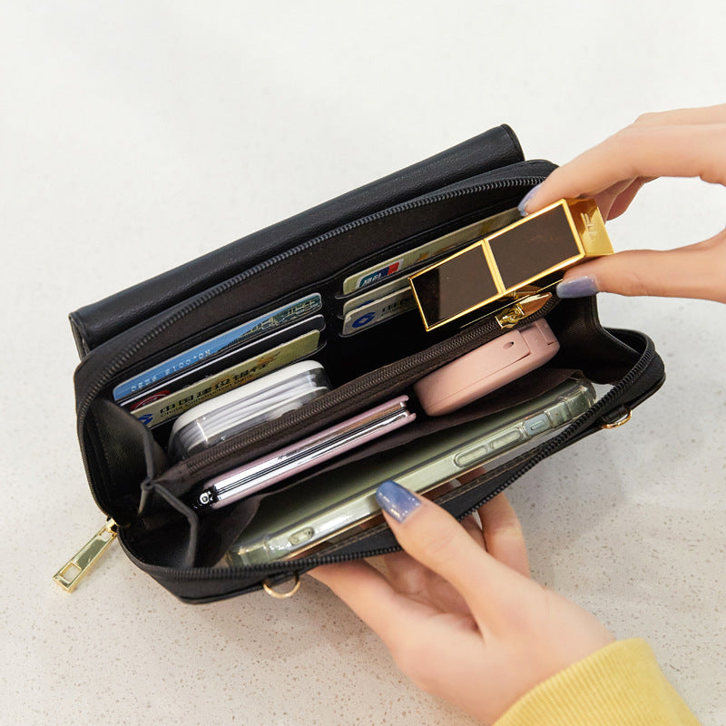 Open Louari bag showing internal card slots, separate sections and central zipped compartment